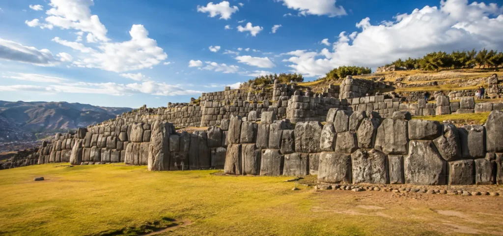 Sacsayhuaman Inca ruins in Cusco, Peru with massive stone walls and mountain views